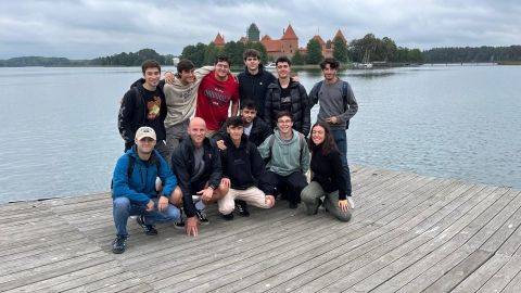 Students doing an exchange near a lake